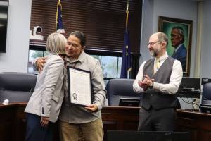 X̱unei Lance Twitchell receives his legislative citation from Rep. Andi Story, D Juneau, at a ceremony at the Alaska State Capitol on Saturday, June 28, 2025. (Ellie Ruel / Juneau Empire)