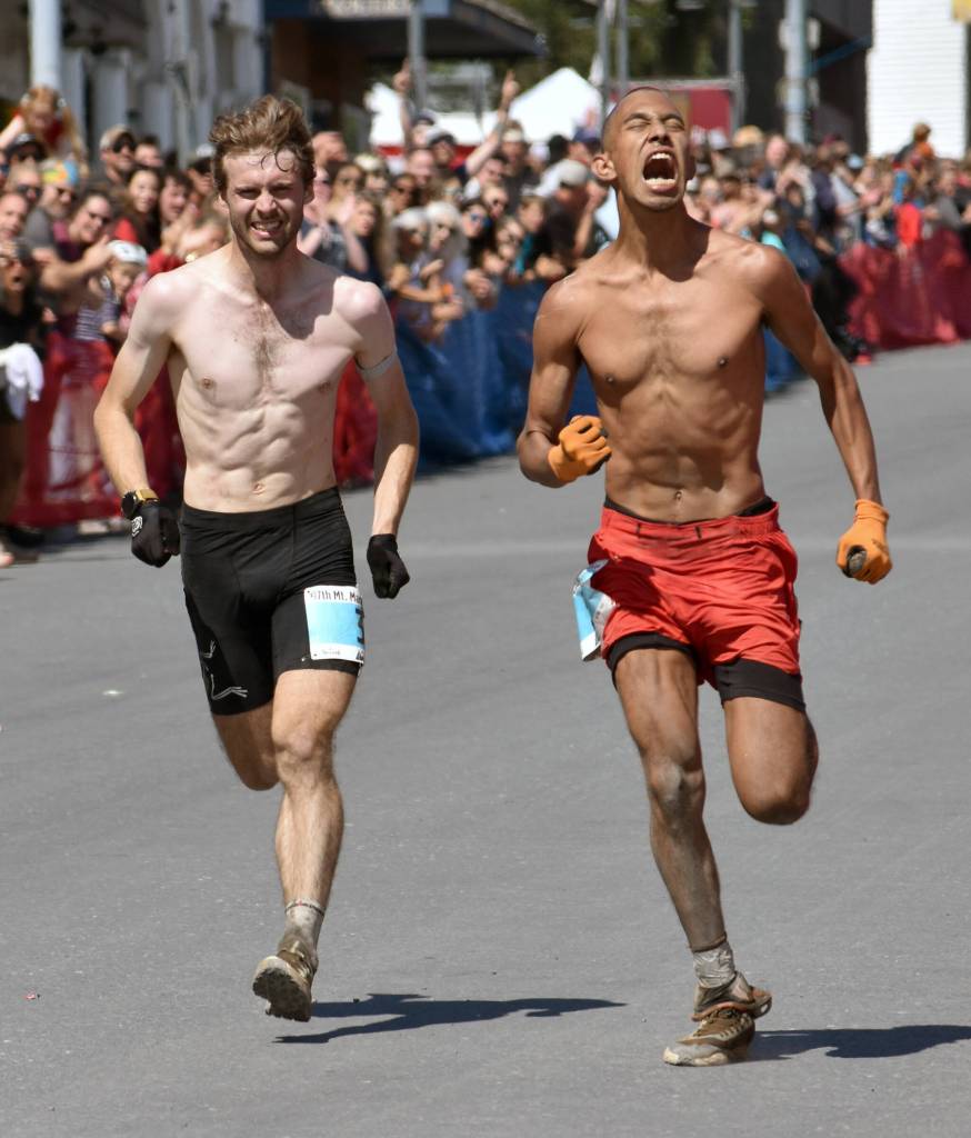 Jessie McAuley, 25, of British Columbia and Bodhi Gross, 24, of South Lake Tahoe, California, sprint to the finish of the mens race at the Mount Marathon Race on July 4, 2025, in Seward, Alaska. (Photo by Jeff Helminiak/Peninsula Clarion)