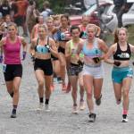 Palmers Christy Marvin, 44; British Columbias Kalie McCrystal, 37; Fairbanks Kendall Kramer, 23; Fairbanks Rosie Fordham, 23; and Anchorages Klaire Rhodes, 27, approach the mountain during the womens race at the Mount Marathon Race on July 4, 2025, in Seward, Alaska. (Photo by Jeff Helminiak/Peninsula Clarion)