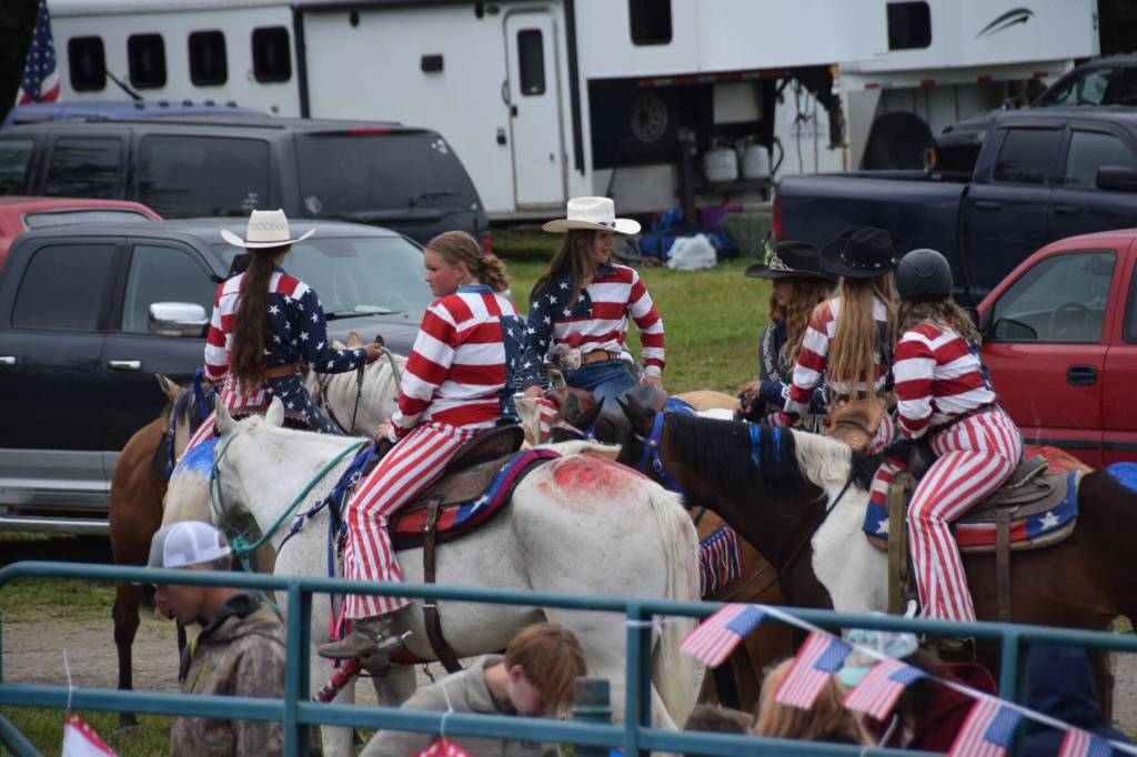 Youth await their turn during the steer daubing competition on Sunday, July 6, 2025, at the Kenai Peninsula Fairgrounds in Ninilchik, Alaska. (Chloe Pleznac/Homer News)