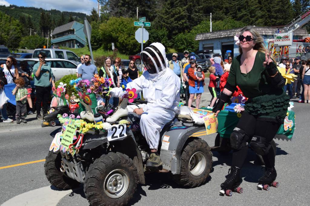 A member of the Homer Bay Rollers skitches down Pioneer Avenue during the Fourth of July parade on Friday, July 4, 2025, in Homer, Alaska. (Delcenia Cosman/Homer News)