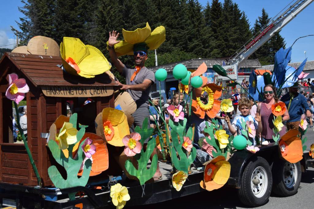 The Pratt Museums float features Poppies of the Pratt and the historic Harrington Cabin during the Fourth of July parade on Friday, July 4, 2025, in Homer, Alaska. (Delcenia Cosman/Homer News)