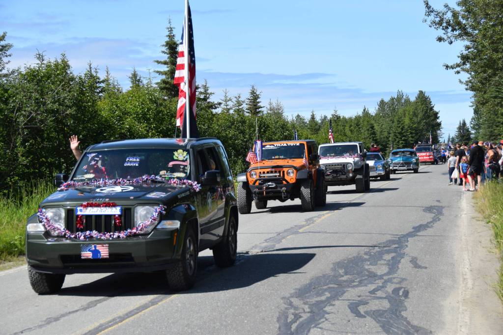 Cars proceed down Milo Fritz Avenue during the Fourth of July parade on Friday, July 4, 2025, in Anchor Point, Alaska. (Delcenia Cosman/Homer News)