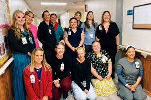 Members of the SPH Long Term Care staff pause for moment of recognition. (Photo courtesy of South Peninsula Hospital)