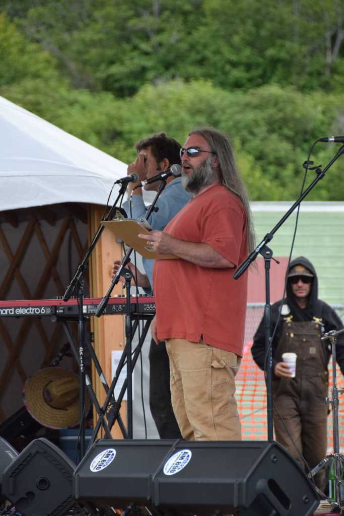 KBBI AM 890 general manager Josh Krohn thanks Concert on the Lawn sponsors on Saturday, July 12, 2025, at Karen Hornaday Park in Homer, Alaska. (Delcenia Cosman/Homer News)