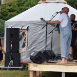 A Concert on the Lawn attendee dances up close to the stage during The Discopians performance on Saturday, July 12, 2025, at Karen Hornaday Park in Homer, Alaska. (Delcenia Cosman/Homer News)