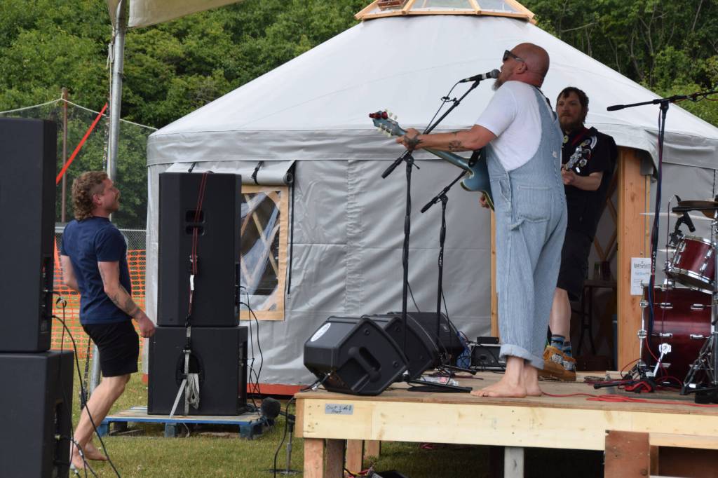 A Concert on the Lawn attendee dances up close to the stage during The Discopians performance on Saturday, July 12, 2025, at Karen Hornaday Park in Homer, Alaska. (Delcenia Cosman/Homer News)