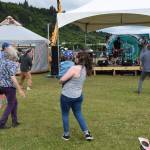 Concert-goers dance to music by The Discopians at Concert on the Lawn on Saturday, July 12, 2025, at Karen Hornaday Park in Homer, Alaska. (Delcenia Cosman/Homer News)