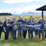 Members of the Homer High School Class of 1975 hold up a banner during their 50-year reunion on Saturday, July 12, 2025, at the Bishops Beach pavilion in Homer, Alaska. (Delcenia Cosman/Homer News)