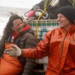 Lisa Gabriel and Brent Johnson chat during a test fishery for a set beach seine near Clam Gulch, Alaska, on Wednesday, July 9, 2025. (Jake Dye/Peninsula Clarion)