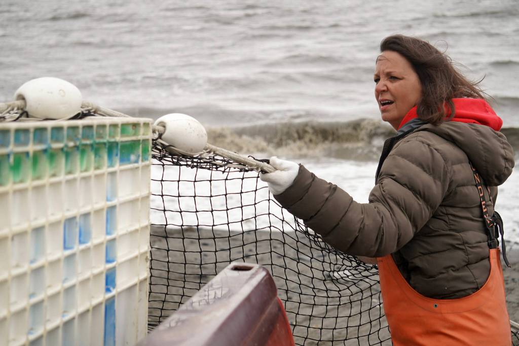 Lisa Gabriel unfurls a set beach seine during a test fishery for the gear near Clam Gulch, Alaska, on Wednesday, July 9, 2025. (Jake Dye/Peninsula Clarion)