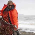 Carey Johnson pulls a set beach seine during a test fishery for the gear near Clam Gulch, Alaska, on Wednesday, July 9, 2025. (Jake Dye/Peninsula Clarion)
