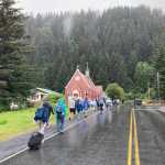 Evacuees in Seward, Alaska, walk along Adams Street following a tsunami warning on Wednesday, July 16, 2025. (Photo by Jeff Helminiak/Peninsula Clarion)