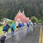 Evacuees in Seward, Alaska, walk along Adams Street following a tsunami warning on Wednesday, July 16, 2025. (Photo by Jeff Helminiak/Peninsula Clarion)