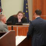 Attorneys Eric Derleth and Dan Strigle speak to Superior Court Judge Kelly Lawson during the opening arguments of State of Alaska v. Nathan Erfurth at the Kenai Courthouse in Kenai, Alaska, on Wednesday, July 16, 2025. (Jake Dye/Peninsula Clarion)