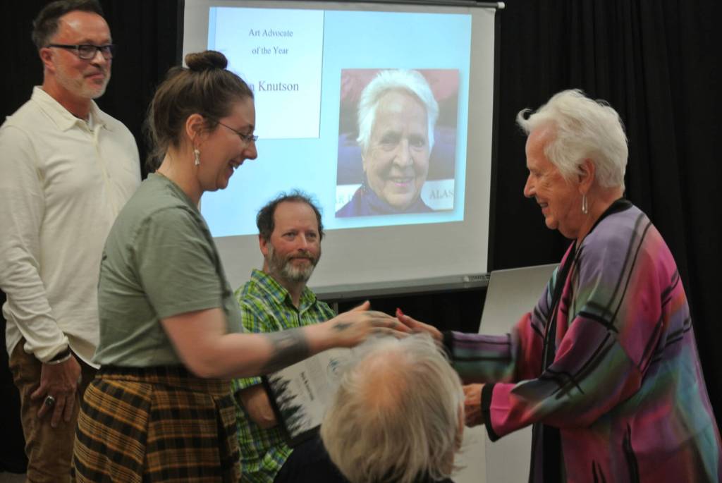 Homer Chamber of Commerce Visitor Center Director Jan Knutson (right) accepts the Art Advocate award at Homer Council on the Arts annual Community Arts Award Ceremony on Saturday, July 19, 2025, in Homer, Alaska. (Delcenia Cosman/Homer News)