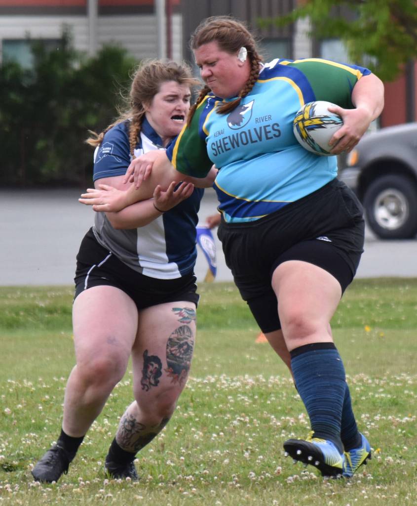 Meredith Harber, captain of the Kenai River SheWolves, runs against Maggie Knight of Fairbanks at the Kenai Dipnet Fest Rugby 10s Tournament at Kenais Millennium Square on Saturday, July 19, 2025. (Photo by Jeff Helminiak/Peninsula Clarion)