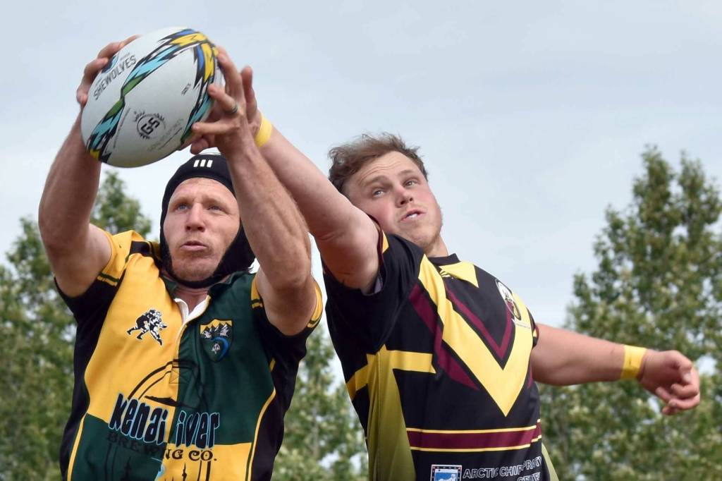 Mike Lundgren of Homer, playing for the Kenai River Wolfpack, snatches the ball from Austin Hinton of the Bird Creek Barbarians at the Kenai Dipnet Fest Rugby 10s Tournament at Kenai's Millennium Square on Saturday, July 19, 2025. (Photo by Jeff Helminiak/Peninsula Clarion)