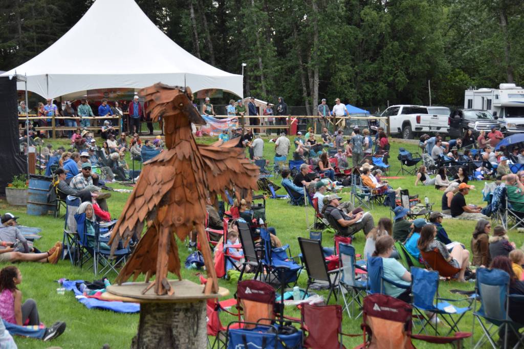 A wooden bird sculpture looks on and over attendees during Salmonfest 2025 on Friday, Aug. 2, at the Kenai Peninsula Fairgrounds in Ninilchik. (Chloe Pleznac/Homer News)