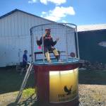 Fair organizer Jack Money sits in a dunk tank as part of Ninilchiks Save the Pool fundraiser during the Kenai Peninsula Fair, Aug. 8-10, 2025, in Ninilchik, Alaska. (Photo courtesy of Jack Money)