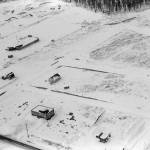 This April 1961 aerial of Soldotna showsin the upper leftthe gravel pit where the Kenai Peninsula Boroughs administration building would be constructed a decade later. The faint road running diagonally from the upper left would later become Binkley Street. The rectangular building in the lower middle portion of the image is the central peninsulas first medical-dental clinic. (Photo courtesy of the Fair Family Collection)