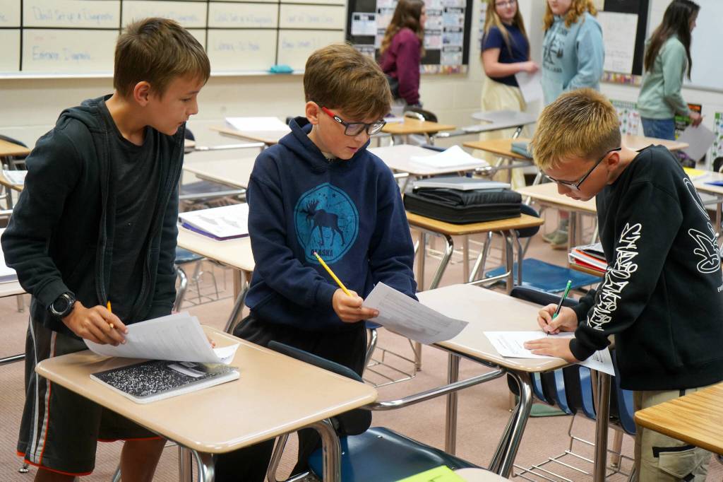 Students work on an orientation scavenger hunt on the first day of the 2025-2026 school year at Nikiski Middle/High School in Nikiski, Alaska, on Wednesday, Aug. 20, 2025. (Jake Dye/Peninsula Clarion)