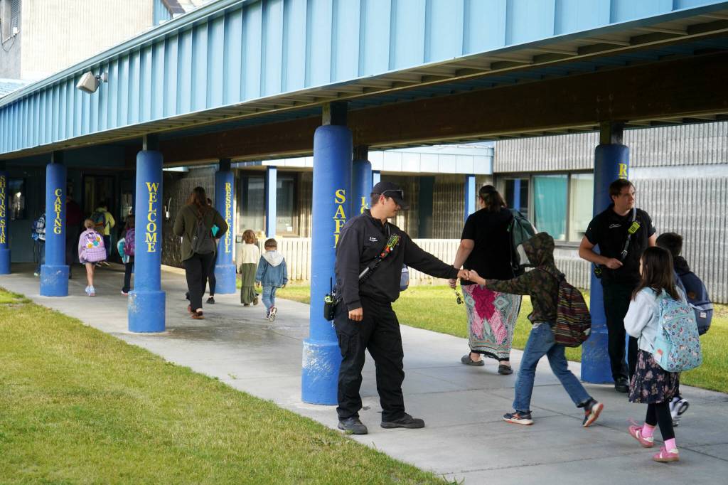 Nikiski Fire Service Area staff greet incoming students on the first day of the 2025-2026 school year at Nikiski North Star Elementary School in Nikiski, Alaska, on Wednesday, Aug. 20, 2025. (Jake Dye/Peninsula Clarion)