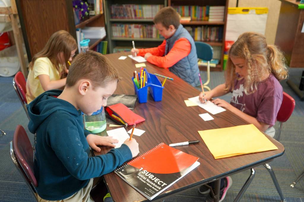 Fourth grade students work on their new name tags on the first day of the 2025-2026 school year at Nikiski North Star Elementary School in Nikiski, Alaska, on Wednesday, Aug. 20, 2025. (Jake Dye/Peninsula Clarion)