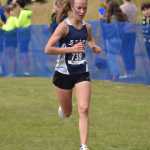 Soldotnas Tania Boonstra nears the finish of the girls varsity race at the Ted McKenney XC Invitational on Saturday, Aug. 23, 2025, at Tsalteshi Trails just outside of Soldotna, Alaska. (Photo by Jeff Helminiak/Peninsula Clarion)