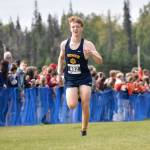 Homers Caleb Bunker sprints to the finish at the Ted McKenney XC Invitational on Saturday, Aug. 23, 2025, at Tsalteshi Trails just outside of Soldotna, Alaska. (Photo by Jeff Helminiak/Peninsula Clarion)