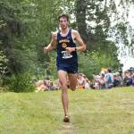 Homers Johannes Bynagle runs to third place in the boys varsity race at the Ted McKenney XC Invitational on Saturday, Aug. 23, 2025, at Tsalteshi Trails just outside of Soldotna, Alaska. (Photo by Jeff Helminiak/Peninsula Clarion)