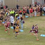 Chugiaks Dausen Loughman leads at the start of the boys varsity race at the Ted McKenney XC Invitational on Saturday, Aug. 23, 2025, at Tsalteshi Trails just outside of Soldotna, Alaska. (Photo by Jeff Helminiak/Peninsula Clarion)