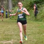Sewards Indigo Leslie runs down a hill at the Ted McKenney XC Invitational on Saturday, Aug. 23, 2025, at Tsalteshi Trails just outside of Soldotna, Alaska. (Photo by Jeff Helminiak/Peninsula Clarion)
