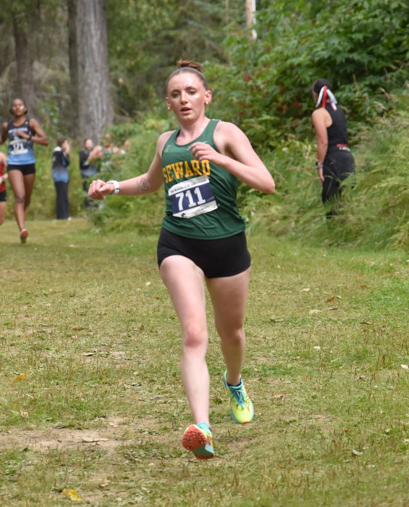 Sewards Indigo Leslie runs down a hill at the Ted McKenney XC Invitational on Saturday, Aug. 23, 2025, at Tsalteshi Trails just outside of Soldotna, Alaska. (Photo by Jeff Helminiak/Peninsula Clarion)