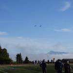 A pair of sandhill cranes fly over the game. (Chloe Pleznac/Homer News)