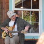 Artist Chaepter performs at the Mermaid Cafe on Friday, Aug. 22, 2025. He kicked off his Alaska tour, along with fellow musician Hemlock, with the porchside show in Homer. (Chloe Pleznac/Homer News)