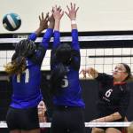 Kenai Centrals Bryleigh Williams attacks against Palmers Leila Petersen and Rainee Reiter on Saturday, Sept. 6, 2025, at the 18th annual Shayna Pritchard Memorial Volleyball Tournament at Nikiski Middle-High School in Nikiski, Alaska. (Photo by Jeff Helminiak/Peninsula Clarion)