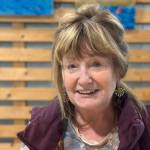 Artist Rosemary "Rozzi" Redmond shows a series of acrylic paintings with fishing themes at Grace Ridge Brewing in Homer, Alaska. The exhibit is open through September 2025. Photo by Christina Whiting