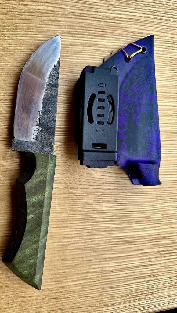 A small chopper or large skinner knife crafted by Jaxon Bourne is made from an old lawnmower blade, with a handle made from stabilized curly maple. Photo provided by Jaxon Bourne