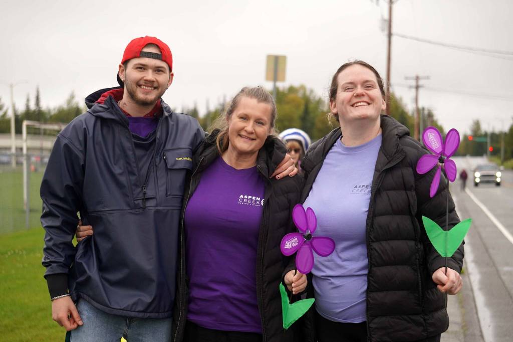 Staff from Aspen Creek Senior Living stand for a photo during the Third Annual Kenai Peninsula Walk to End Alzheimers on North Tinker Lane in Kenai, Alaska, on Saturday, Sept. 13, 2025. (Jake Dye/Peninsula Clarion)
