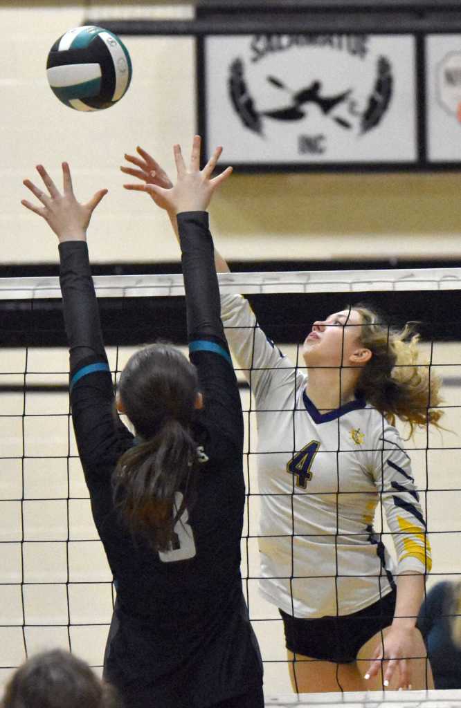 Homers Reilly Sue Baker attacks against Nikiskis Addison Perkins on Tuesday, Sept. 23, 2025, at Nikiski Middle-High School in Nikiski, Alaska. (Photo by Jeff Helminiak/Peninsula Clarion)