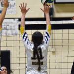 Nikiskis Hailey Hutchins attacks against Homers Madaln Miotke and Gracey Bradshaw on Tuesday, Sept. 23, 2025, at Nikiski Middle-High School in Nikiski, Alaska. (Photo by Jeff Helminiak/Peninsula Clarion)