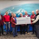 Homer Elks Lodge #2127 Exalted Ruler Jill Hockema (center) and members of the Homer Elks Lodge donate $3,500, using grant funds received, to West Homer Elementary School in Homer, Alaska, on Sept. 22, 2025, to provide fourth-grade students the opportunity to participate in the annual Outdoor Education Field Trip scheduled for May 2026. Photo provided by Jill Hockema