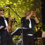 The KP Brass Band plays on the Porcupine Theater stage during the Pratt Museums Red Carpet Ritz fundraiser on Saturday, Oct. 4, 2025, in Homer, Alaska. (Delcenia Cosman/Homer News)
