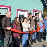 Homer Chamber of Commerce staff and board members, City of Homer staff and Fika Coffee Roasters owners Sierra Moskios and Tyler Schlieman (center) gather for a ribbon cutting ceremony during Fikas grand opening at ZenDen Cafe on Tuesday, Oct. 7, 2025, in Homer, Alaska. (Delcenia Cosman/Homer News)