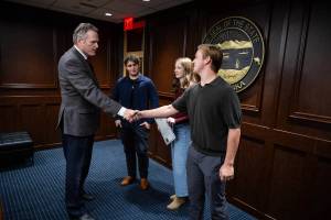 Alaska Governor Mike Dunleavy meets with members of the University of Alaska Anchorage chapter of Turning Point on Tuesday, Oct. 14, 2025, the same day he proclaimed Charlie Kirk Day. (Governor Mike Dunleavy/Facebook)