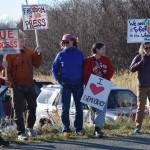 Protesters hold signs championing due process and freedom of the press during the No Kings demonstration on Saturday, Oct. 18, 2025, in Homer, Alaska. (Delcenia Cosman/Homer News)