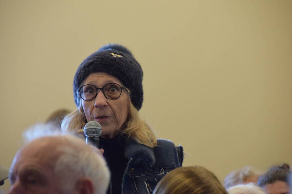Local resident and audience member Nona Safra asks a question for the panel during the Citizens Town Hall meeting on Saturday, Oct. 18, 2025, at Kachemak Bay Campus in Homer, Alaska. (Delcenia Cosman/Homer News)