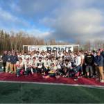 The Homer Mariners varsity football team gathers for a celebratory photo following their victory against Barrow in the Division III state championships game on Saturday, Oct. 18, 2025, in Wasilla, Alaska. Photo provided by Justin Zank