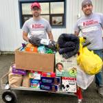 Volunteers for the Western Alaska disaster response receive one of several loads of donations from Homer area community members on Monday, Oct. 27, 2025, at the main drop-off site in Anchorage, Alaska. Photo by Christina Whiting